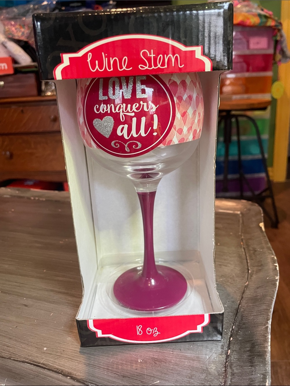 "Love Conquers All" Pink Stem Wine Glass